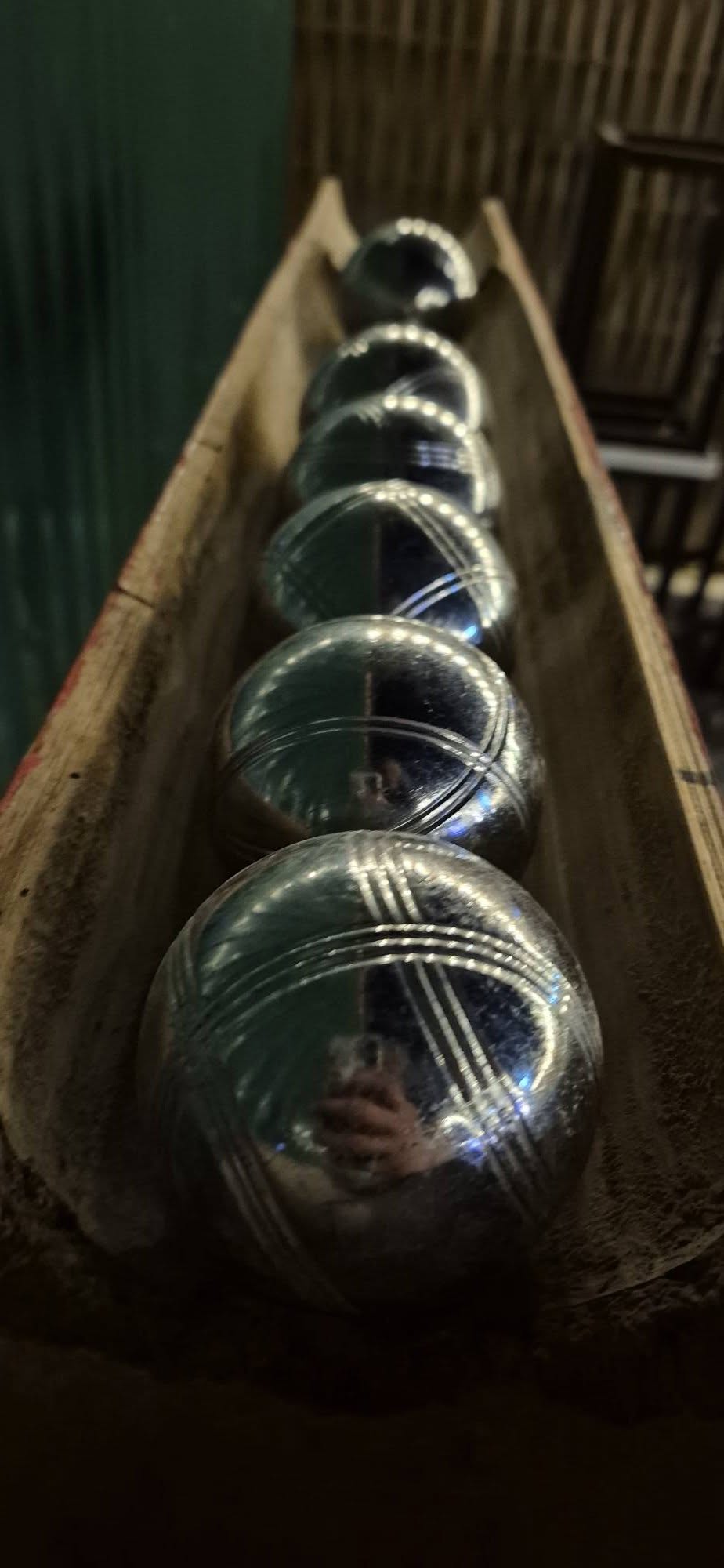 A row of mini golf balls ready to play